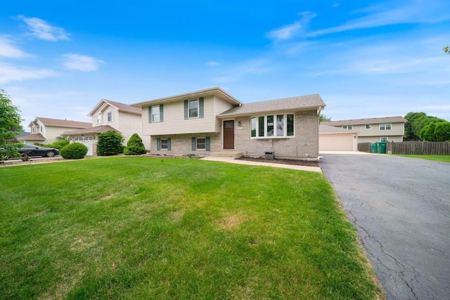2113 Lolo Pass Dr, Plainfield, IL 60586 - tri-level home featuring brick siding and a detached garage