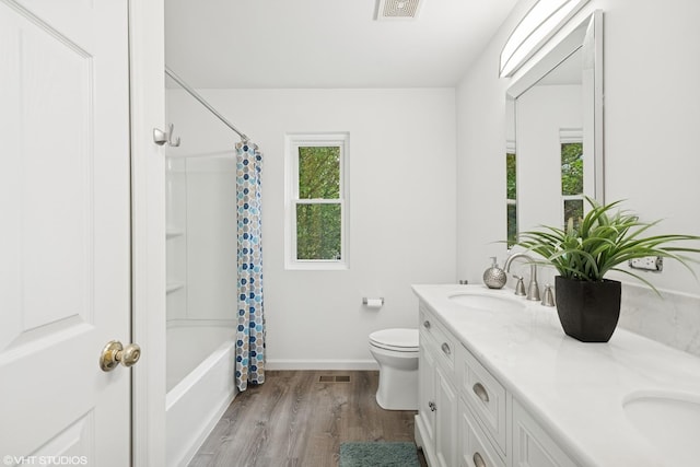 11 Litchfield Ct, Lake In The Hills, IL 60156 - full bathroom with wood finished floors, double vanity, and shower / bath combination with curtain