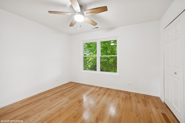 11 Litchfield Ct, Lake In The Hills, IL 60156 - unfurnished bedroom with light wood finished floors, a closet, and a ceiling fan