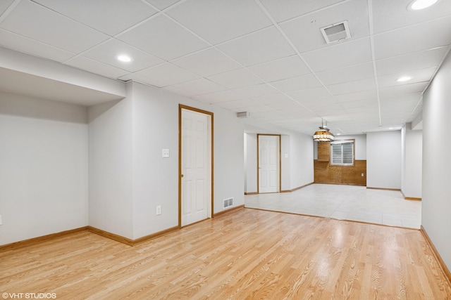 11 Litchfield Ct, Lake In The Hills, IL 60156 - finished below grade area with light wood-style flooring, a drop ceiling, and recessed lighting