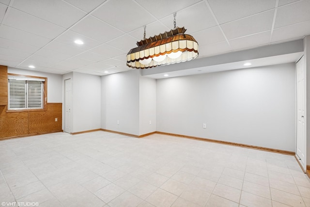 11 Litchfield Ct, Lake In The Hills, IL 60156 - finished basement featuring a drop ceiling, recessed lighting, wood walls, and a wainscoted wall