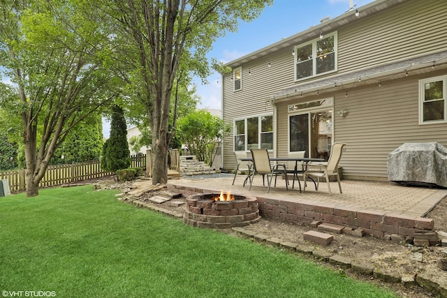 11 Litchfield Ct, Lake In The Hills, IL 60156 - rear view of house with a fire pit and a patio area