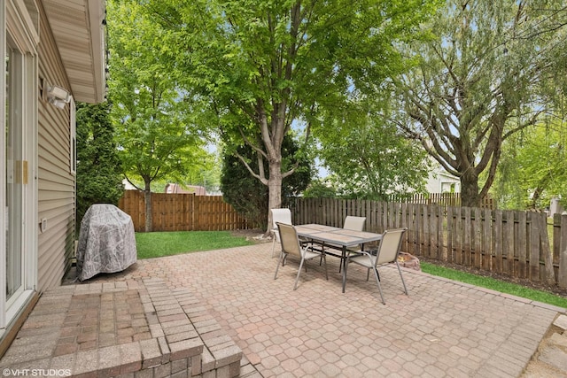 11 Litchfield Ct, Lake In The Hills, IL 60156 - fenced backyard with a patio area and outdoor dining space