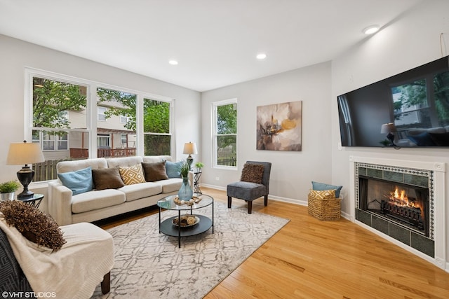 11 Litchfield Ct, Lake In The Hills, IL 60156 - living room with wood finished floors, a fireplace, and recessed lighting