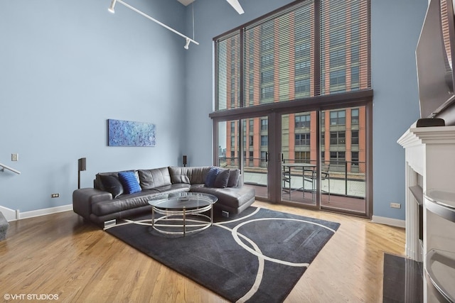 616 W Fulton St Unit 703, Chicago, IL 60661 - living room featuring a high ceiling and wood finished floors