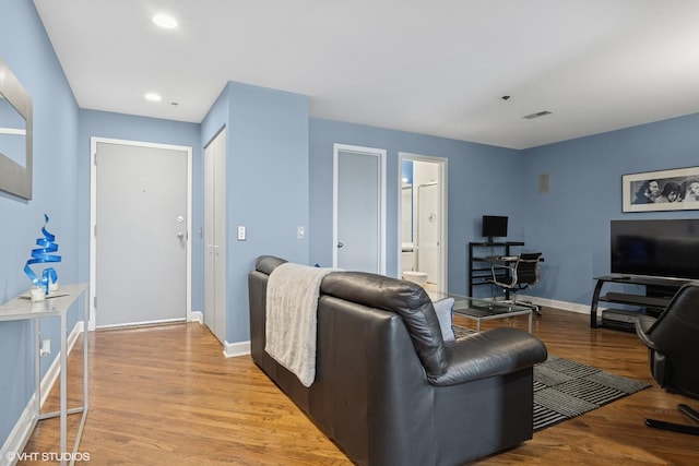 616 W Fulton St Unit 703, Chicago, IL 60661 - living room with a desk, wood finished floors, and recessed lighting