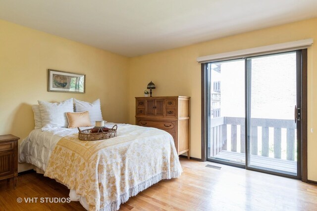 338 Sheridan Dr Unit 1F, Willowbrook, IL 60527 - bedroom featuring light wood finished floors and access to exterior