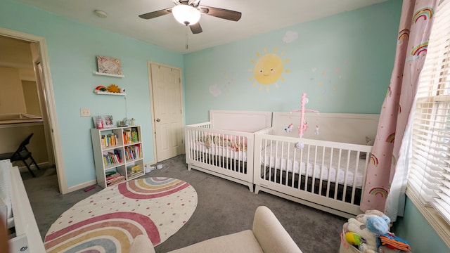 3908 Summer Sage Ct, Champaign, IL 61822 - carpeted bedroom with a crib and a ceiling fan