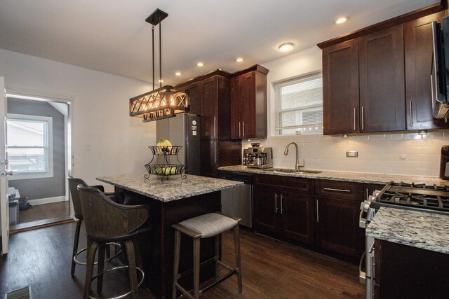 5236 W Nelson St, Chicago, IL 60641 - kitchen featuring stainless steel appliances, dark wood-style flooring, healthy amount of natural light, and recessed lighting
