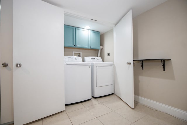 5236 W Nelson St, Chicago, IL 60641 - laundry room with cabinet space, washing machine and dryer, and light tile patterned floors