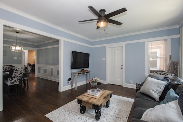 5236 W Nelson St, Chicago, IL 60641 - living area featuring a ceiling fan, wood finished floors, a chandelier, ornamental molding, and a wainscoted wall