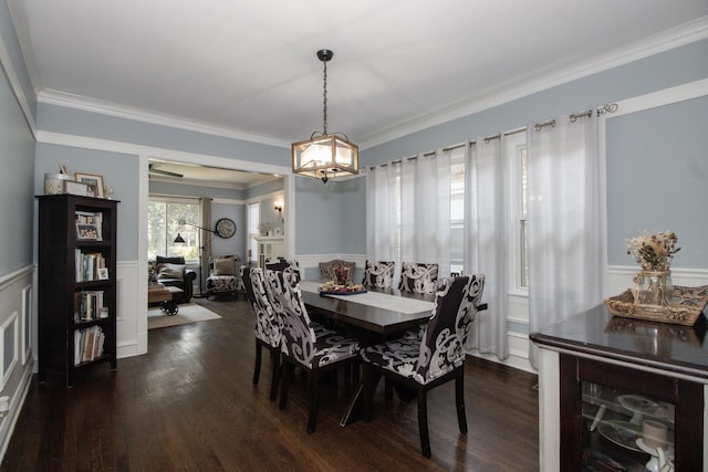 5236 W Nelson St, Chicago, IL 60641 - dining room featuring wainscoting, a decorative wall, ornamental molding, a chandelier, and dark wood-style floors