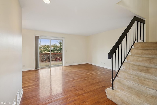 218 E Forest Knoll Dr, Palatine, IL 60074 - unfurnished living room featuring wood finished floors, baseboards, and stairs