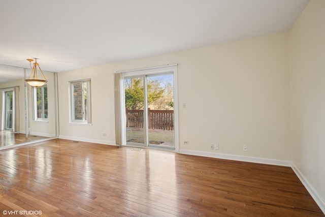 218 E Forest Knoll Dr, Palatine, IL 60074 - spare room featuring wood-type flooring and baseboards