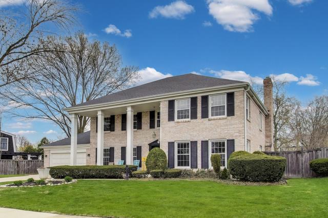 613 Michelline Ln, Northbrook, IL 60062 - greek revival inspired property with a chimney and a garage