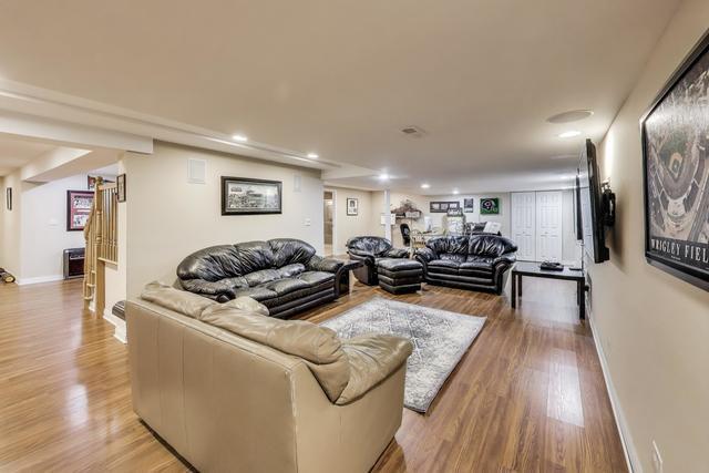 613 Michelline Ln, Northbrook, IL 60062 - living area featuring light wood-style floors, recessed lighting, and baseboards