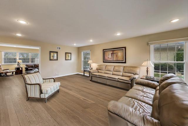 613 Michelline Ln, Northbrook, IL 60062 - living room featuring recessed lighting, healthy amount of natural light, wood finished floors, and baseboards