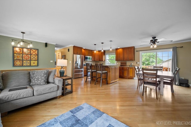 1035 Warwick Cir N, Hoffman Estates, IL 60169 - living room with ornamental molding, light wood finished floors, and a ceiling fan