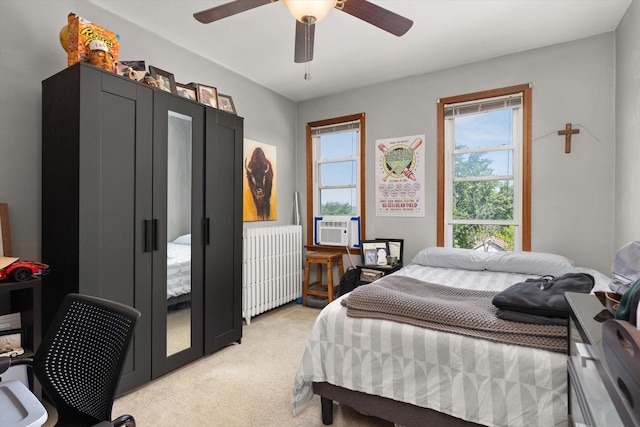 415 Fremont St, Lemont, IL 60439 - bedroom with radiator heating unit, multiple windows, light carpet, and a ceiling fan