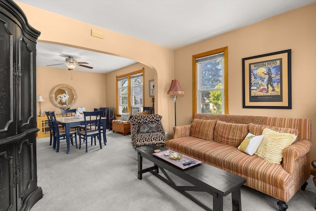 415 Fremont St, Lemont, IL 60439 - living room with healthy amount of natural light, light carpet, arched walkways, and a ceiling fan