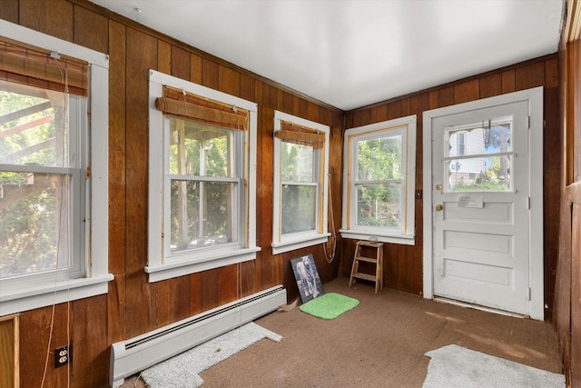 415 Fremont St, Lemont, IL 60439 - unfurnished sunroom featuring a baseboard heating unit, wood walls, and carpet flooring