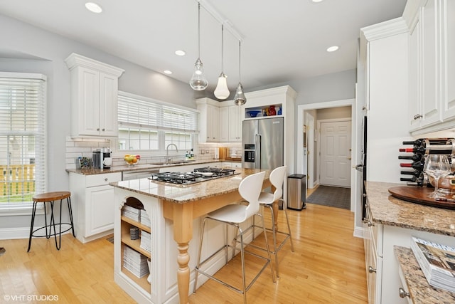 400 Saint Andrews Ln, Gurnee, IL 60031 - kitchen with open shelves, appliances with stainless steel finishes, light wood-type flooring, tasteful backsplash, and recessed lighting