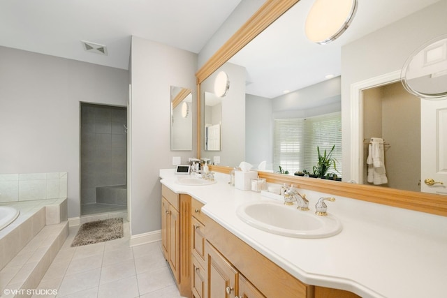 400 Saint Andrews Ln, Gurnee, IL 60031 - bathroom featuring a bath, double vanity, and tile patterned flooring