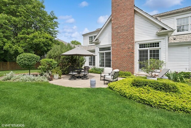 400 Saint Andrews Ln, Gurnee, IL 60031 - back of property featuring a chimney and a patio area