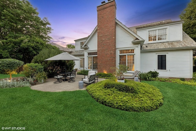 400 Saint Andrews Ln, Gurnee, IL 60031 - back of house featuring a chimney, a patio area, and a yard