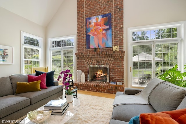 400 Saint Andrews Ln, Gurnee, IL 60031 - living area with high vaulted ceiling, wood finished floors, and a fireplace