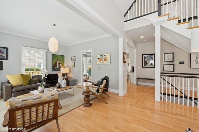 400 Saint Andrews Ln, Gurnee, IL 60031 - living room with light wood-style flooring, ornamental molding, and stairs