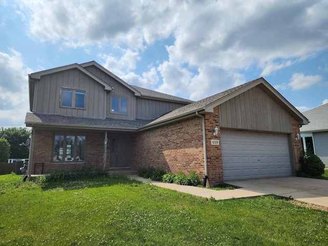 609 Flanagan Dr, Minooka, IL 60447 - view of front of home featuring an attached garage, a front lawn, concrete driveway, and brick siding