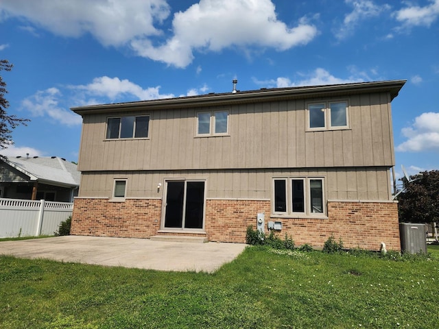 609 Flanagan Dr, Minooka, IL 60447 - back of house featuring brick siding and a patio