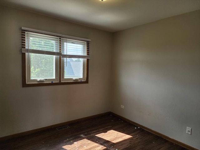 609 Flanagan Dr, Minooka, IL 60447 - unfurnished room with dark wood-style flooring and baseboards