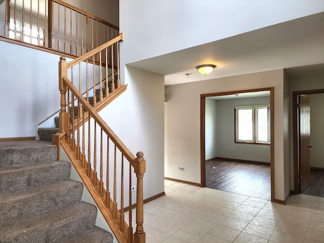 609 Flanagan Dr, Minooka, IL 60447 - stairs featuring tile patterned floors