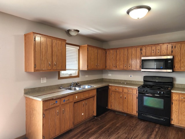 609 Flanagan Dr, Minooka, IL 60447 - kitchen featuring black appliances, dark wood-style flooring, brown cabinets, and light countertops
