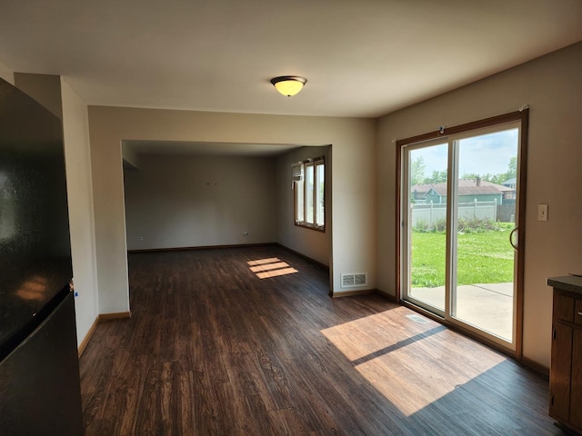 609 Flanagan Dr, Minooka, IL 60447 - empty room with dark wood-type flooring and baseboards