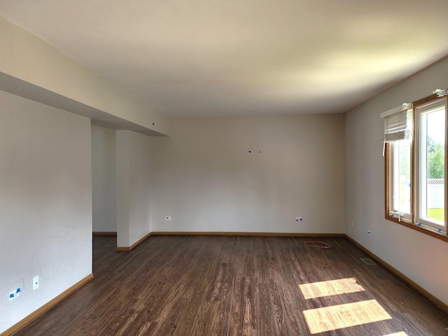 609 Flanagan Dr, Minooka, IL 60447 - empty room featuring wood finished floors and baseboards