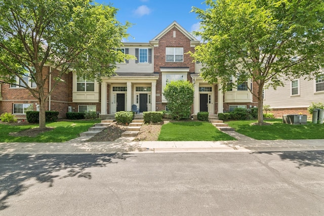 6518 Lilac Blvd, Hanover Park, IL 60133 - multi unit property featuring brick siding and a front yard