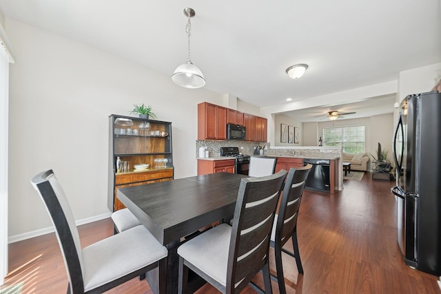 6518 Lilac Blvd, Hanover Park, IL 60133 - dining room with dark wood finished floors and a ceiling fan