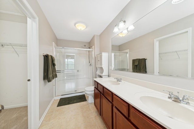 6518 Lilac Blvd, Hanover Park, IL 60133 - bathroom with a stall shower, a spacious closet, double vanity, and tile patterned floors