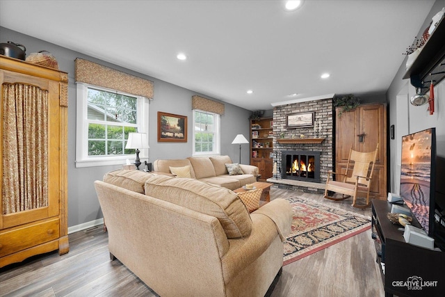 23551 W Winston Ave, Plainfield, IL 60586 - living area featuring a brick fireplace, wood finished floors, and recessed lighting