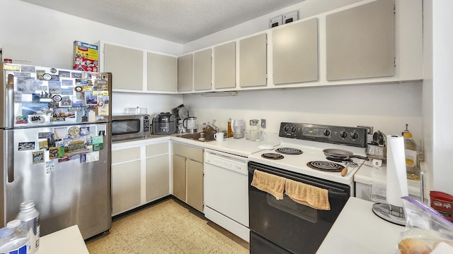 405 N Wabash Ave Unit 2809, Chicago, IL 60611 - kitchen featuring stainless steel appliances, a sink, light flooring, light countertops, and a textured ceiling