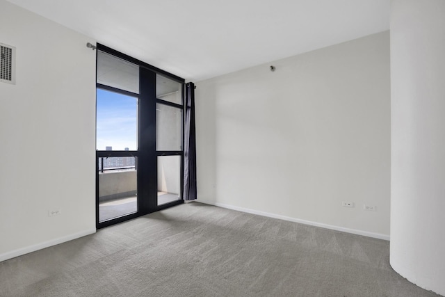 1255 S State St Unit 1704, Chicago, IL 60605 - carpeted empty room with floor to ceiling windows and baseboards