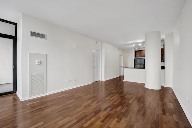 1255 S State St Unit 1704, Chicago, IL 60605 - unfurnished living room featuring dark wood-type flooring and baseboards