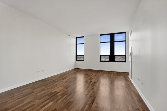 1255 S State St Unit 1704, Chicago, IL 60605 - unfurnished room featuring dark wood-style flooring and baseboards