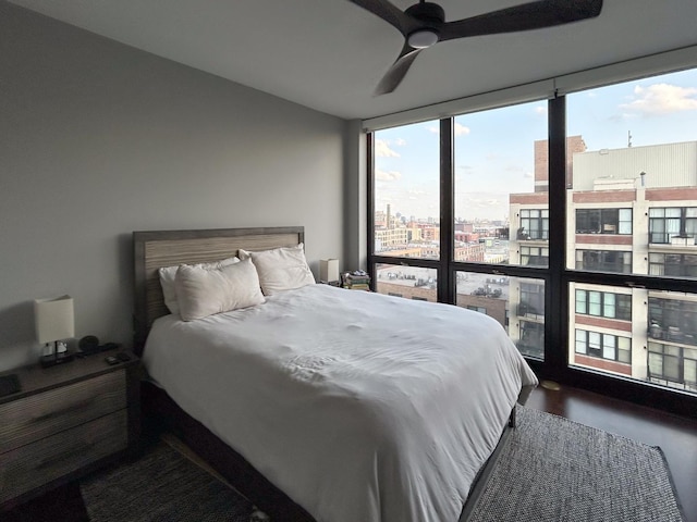210 S Desplaines St Unit 1410, Chicago, IL 60661 - bedroom with a city view, expansive windows, and ceiling fan