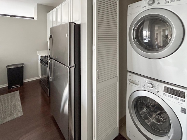 210 S Desplaines St Unit 1410, Chicago, IL 60661 - laundry area featuring estacked washer and dryer and dark wood finished floors