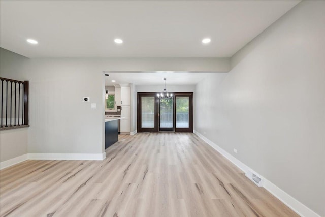 919 E Cooper Dr, Palatine, IL 60074 - unfurnished living room featuring light wood-type flooring, a chandelier, and recessed lighting
