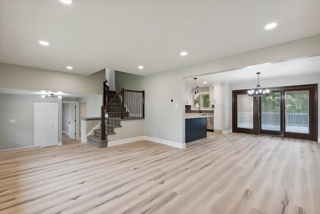 919 E Cooper Dr, Palatine, IL 60074 - unfurnished living room featuring light wood-type flooring, a chandelier, stairs, and recessed lighting
